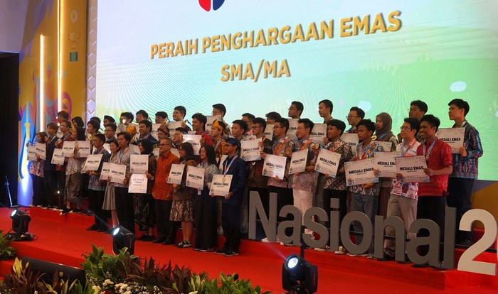 A group of people receiving an award on stage